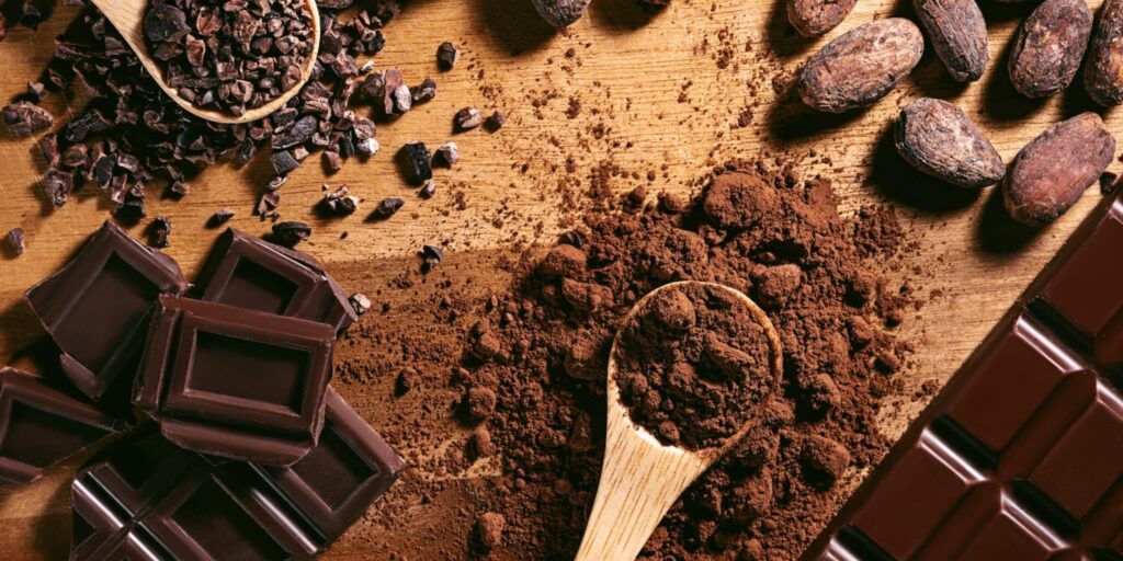 How does cocoa powder color affect production cost?