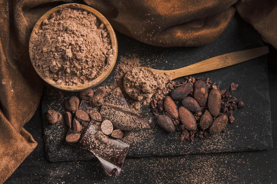 How does cocoa powder stability reduce production waste?