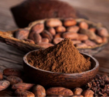 How does cocoa powder stability reduce production waste?