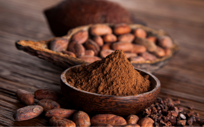 How does cocoa powder stability reduce production waste?